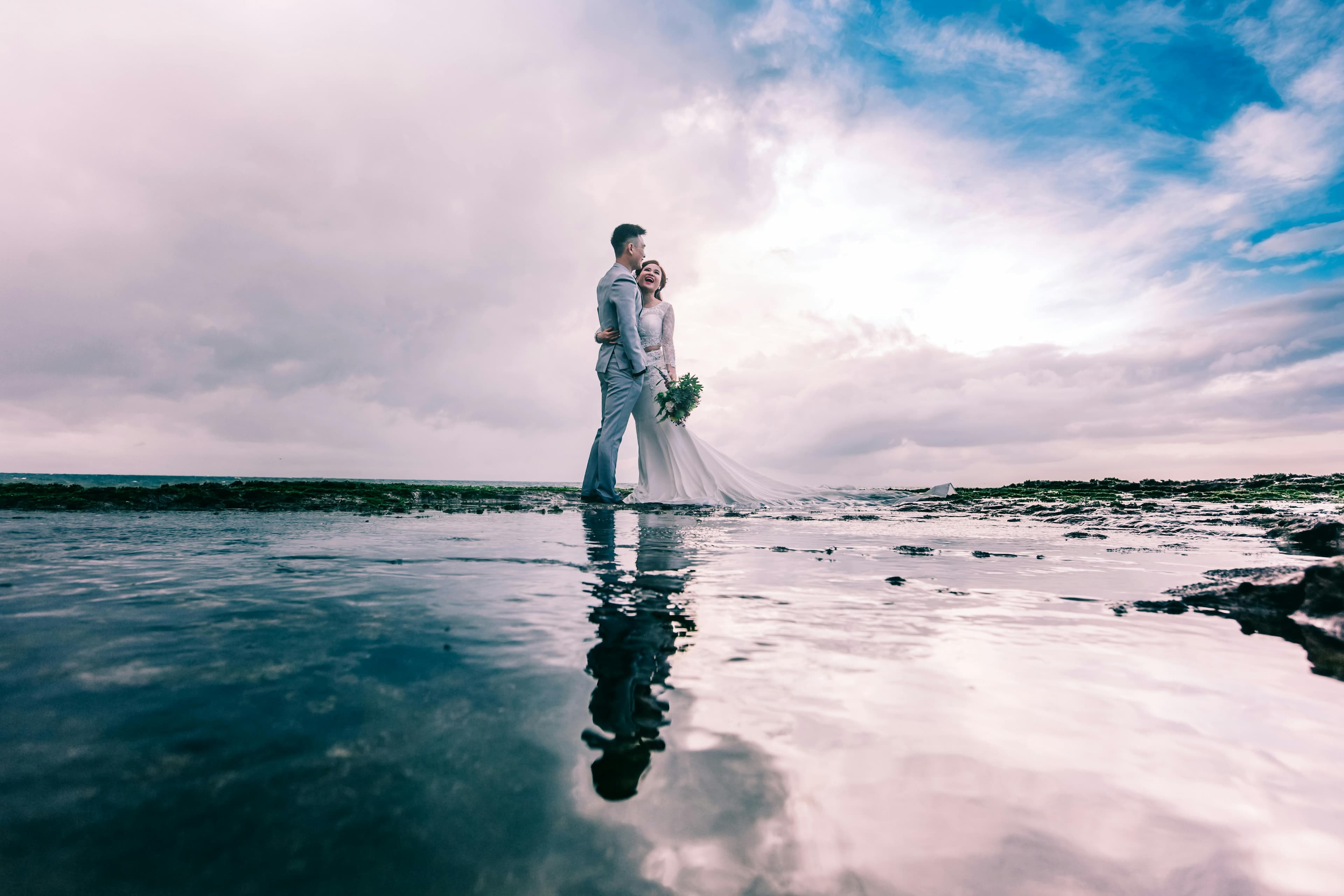Couple sharing a romantic moment at their Cyprus beach wedding ceremony